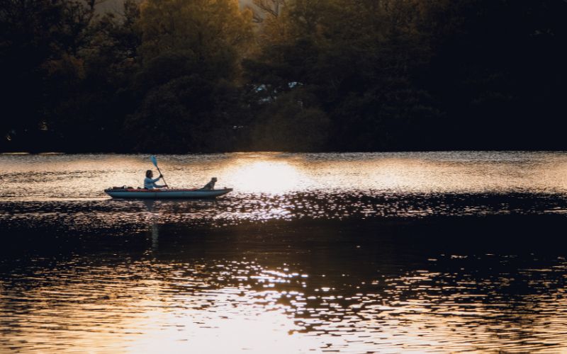 someone kayaking in a lake