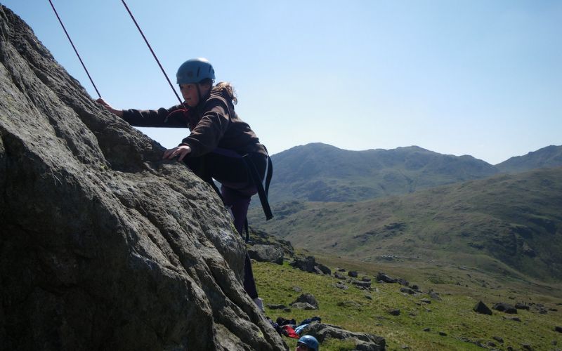 someone rockclimbing