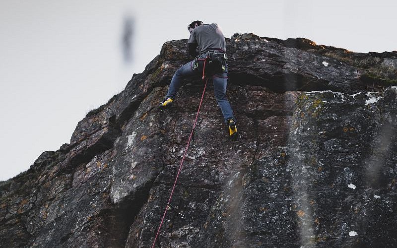 a man rock climbing